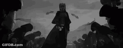 A Black And White Drawing Of A Man In A Mask Standing In Front Of A Crowd Of People . GIF