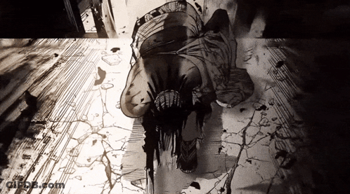 A Black And White Drawing Of A Man Laying On The Floor GIF