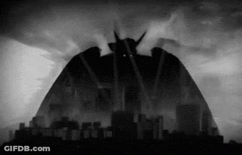 A Black And White Drawing Of A Monster With Horns GIF