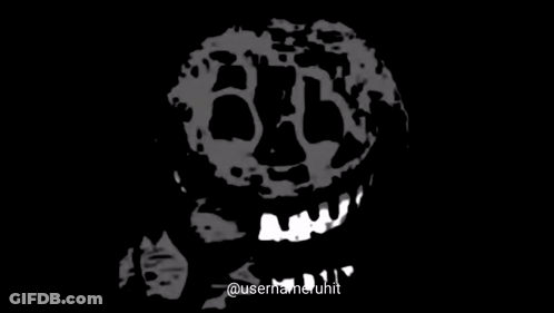 A Black And White Drawing Of A Skull With A Smile On Its Face . GIF