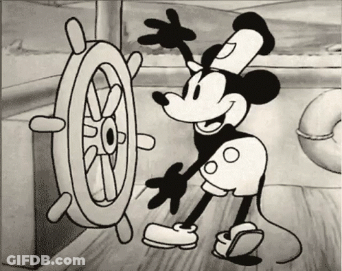 A Black And White Drawing Of Mickey Mouse With A Steering Wheel GIF
