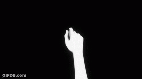 A Black And White Drawing Of Two People Holding Hands . GIF