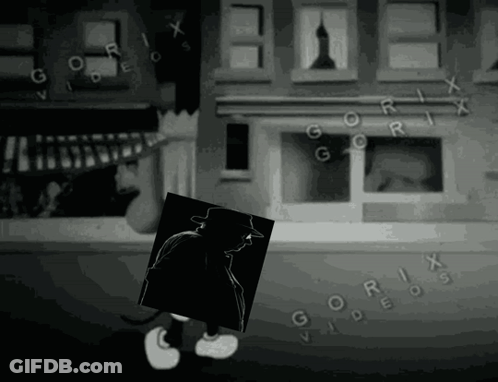 A Black And White Image Of A Cartoon Character Holding A Picture Of A Man In Front Of A Building That Says Gorix GIF