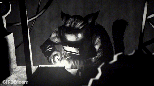A Black And White Image Of A Cat Welding GIF