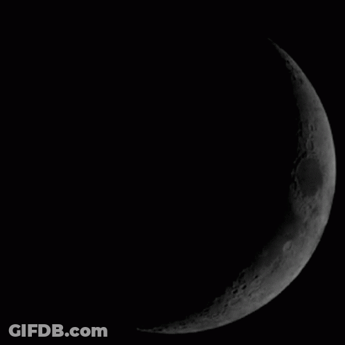 A Black And White Image Of A Full Moon GIF