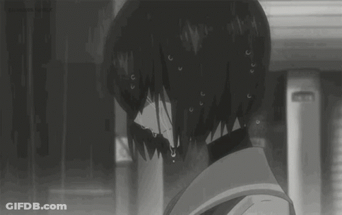 A Black And White Image Of A Girl Crying In The Rain . GIF