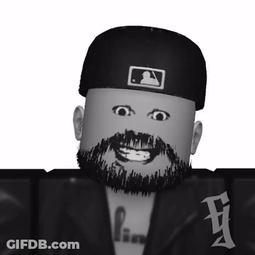A Black And White Image Of A Man With A Beard Wearing A Hat GIF