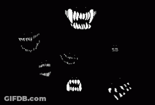 A Black And White Image Of A Monster 'S Mouth With Fangs GIF