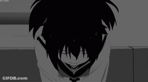 A Black And White Image Of A Person Covering Their Face GIF