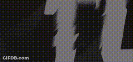 A Black And White Image Of A Person 'S Face With The Letters U And G Visible GIF