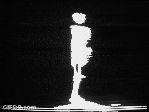 A Black And White Image Of A Person 'S Silhouette GIF