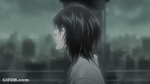 A Black And White Image Of A Person With Long Hair Standing In Front Of A City . GIF