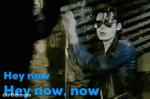 A Black And White Image Of A Person With The Words Hey Now In Blue GIF