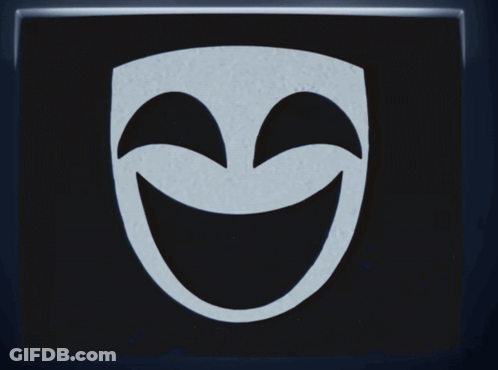 A Black And White Mask With Tears Coming Out Of Its Eyes GIF