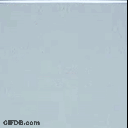 A Black And White Mask With Tears Coming Out Of Its Eyes GIF