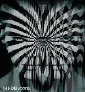 A Black And White Optical Illusion Of A Person 'S Eyes GIF