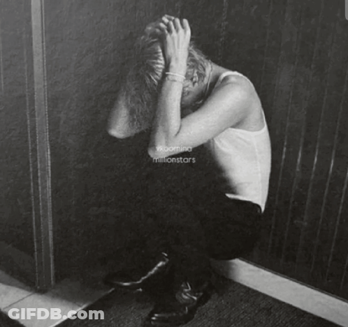 A Black And White Painting Of A Person Covering Their Face GIF