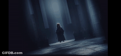 A Black And White Painting Of A Person Walking In The Dark GIF