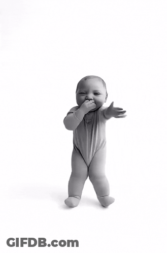 A Black And White Photo Of A Baby Standing On Its Hind Legs GIF