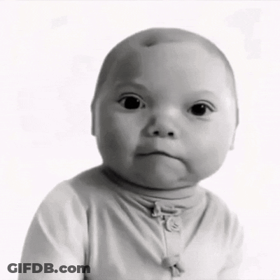 A Black And White Photo Of A Baby Wearing A Turtleneck GIF