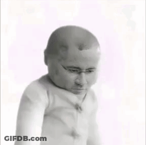 A Black And White Photo Of A Baby With A Bald Head GIF