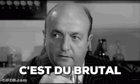 A Black And White Photo Of A Bald Man In A Suit And Tie With The Words `` C'est Du Brutal '' Written On It . GIF