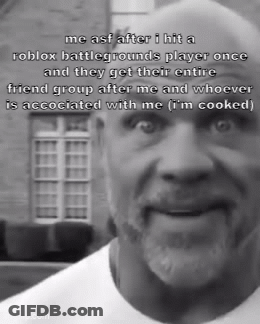 A Black And White Photo Of A Bald Man With A Beard Talking About Roblox Battlegrounds GIF