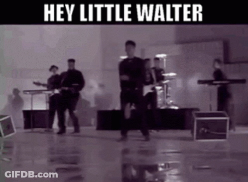 A Black And White Photo Of A Band With The Words Hey Little Walter Below Them GIF