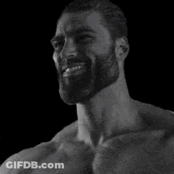 A Black And White Photo Of A Bearded Man Smiling . GIF