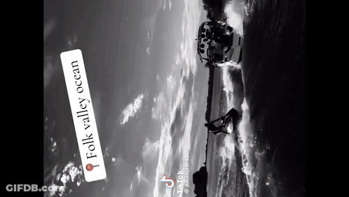 A Black And White Photo Of A Boat In The Water With The Words Folk Valley Ocean Below It GIF