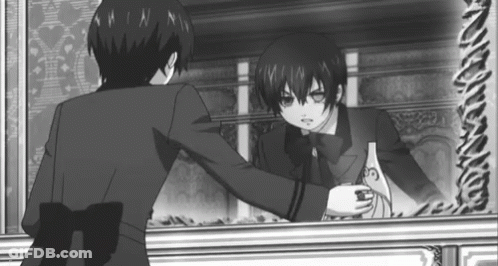 A Black And White Photo Of A Boy Standing In Front Of A Mirror . GIF
