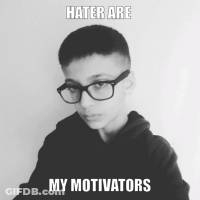 A Black And White Photo Of A Boy Wearing Glasses With The Caption " Hater Are My Motivators " GIF