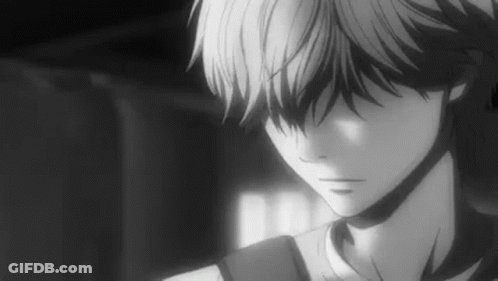 A Black And White Photo Of A Boy With A Backpack Looking Down . GIF