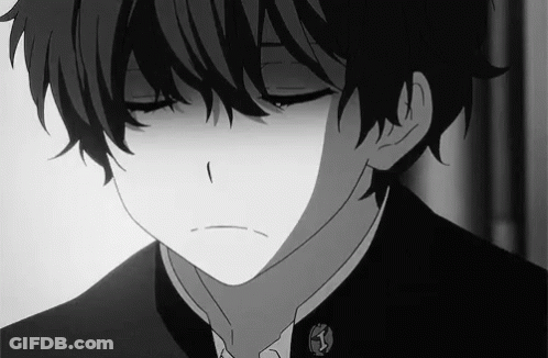 A Black And White Photo Of A Boy With His Eyes Closed And A Sad Look On His Face . GIF