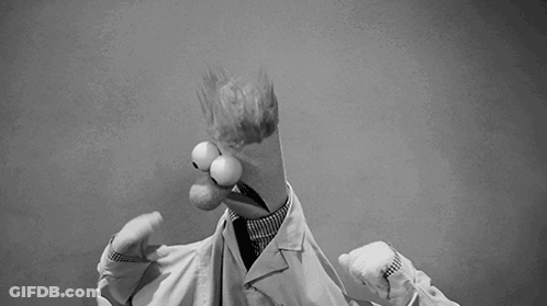 A Black And White Photo Of A Cartoon Character In A Lab Coat And Tie . GIF
