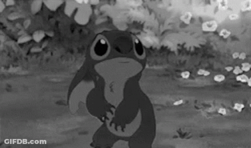 A Black And White Photo Of A Cartoon Character Stitch GIF