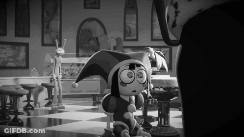 A Black And White Photo Of A Cartoon Character Wearing A Jester 'S Hat . GIF