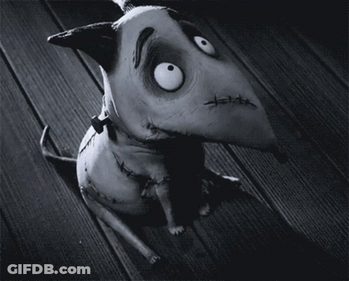 A Black And White Photo Of A Cartoon Dog With Stitches On His Face GIF
