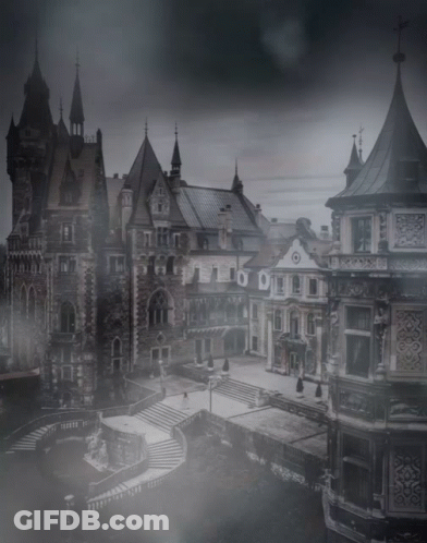 A Black And White Photo Of A Castle With Stairs GIF