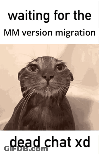 A Black And White Photo Of A Cat With The Caption Waiting For The Mm Version Migration GIF
