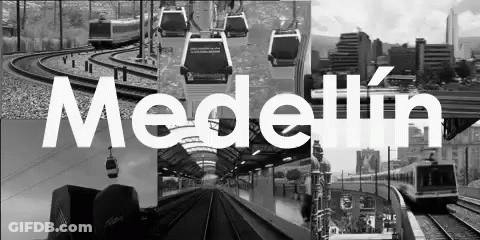 A Black And White Photo Of A City With The Word Medellin In White Letters GIF