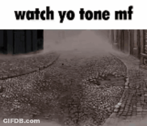 A Black And White Photo Of A Cobblestone Street With The Words `` Watch Yo Tone Mf '' Written On It . GIF