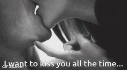 A Black And White Photo Of A Couple Kissing With The Words " I Want To Kiss You All The Time " GIF