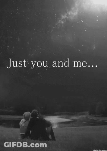 A Black And White Photo Of A Couple Sitting In The Grass With The Words Just You And Me GIF
