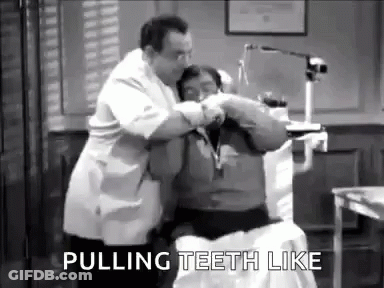 A Black And White Photo Of A Dentist Pulling Teeth Of A Patient . GIF