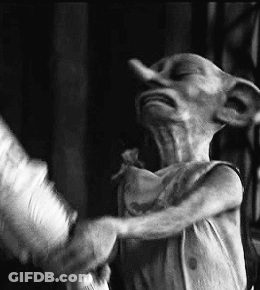 A Black And White Photo Of A Dobby From Harry Potter Standing Next To A Person . GIF