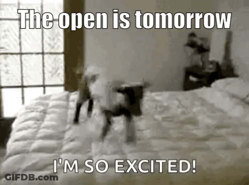 A Black And White Photo Of A Dog Jumping On Top Of A Bed . GIF