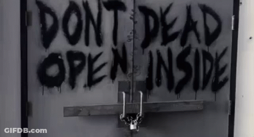 A Black And White Photo Of A Door With The Words Do N't Dead Open Inside Spray Painted On It GIF