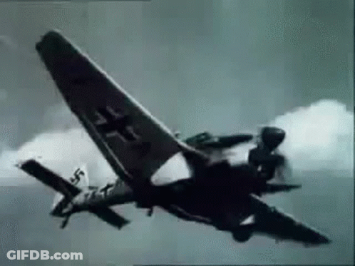 A Black And White Photo Of A Fighter Jet Flying Through The Sky . GIF