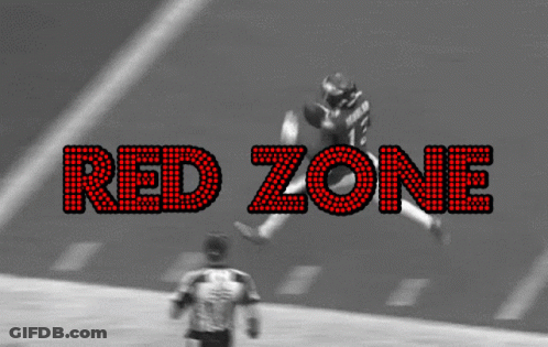 A Black And White Photo Of A Football Game With The Words Red Zone In Red Letters GIF